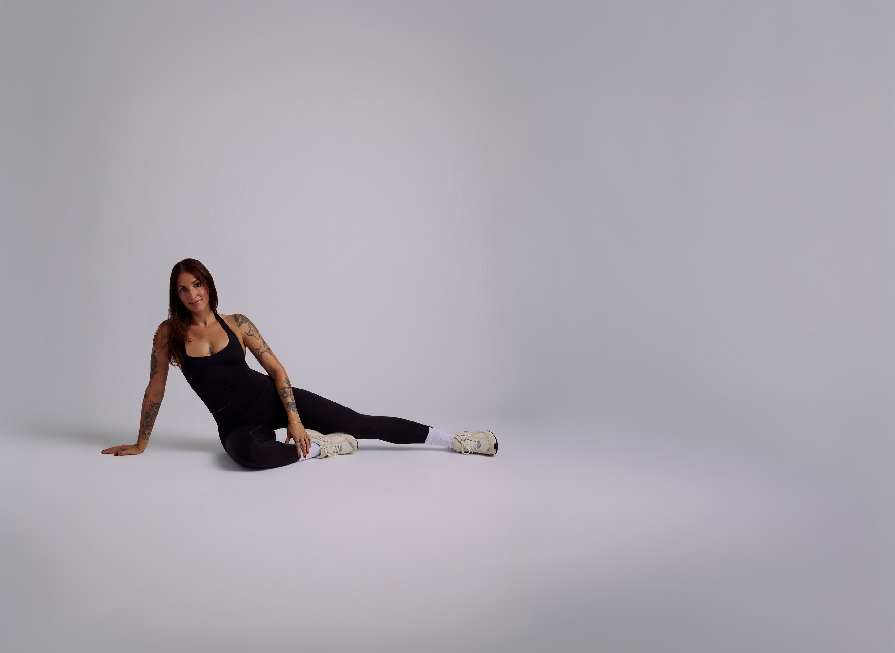Alex, personal trainer, seated portrait